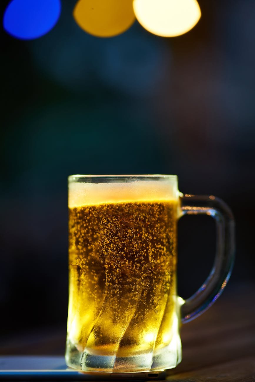 clear glass mug filled with yellow liquid