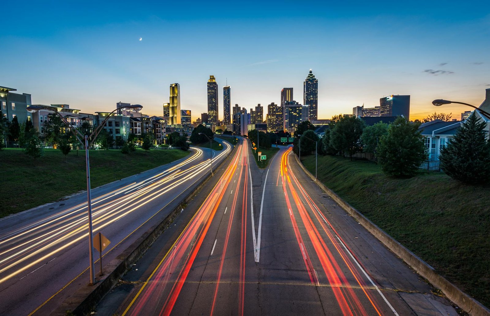 time lapse photography of road near town