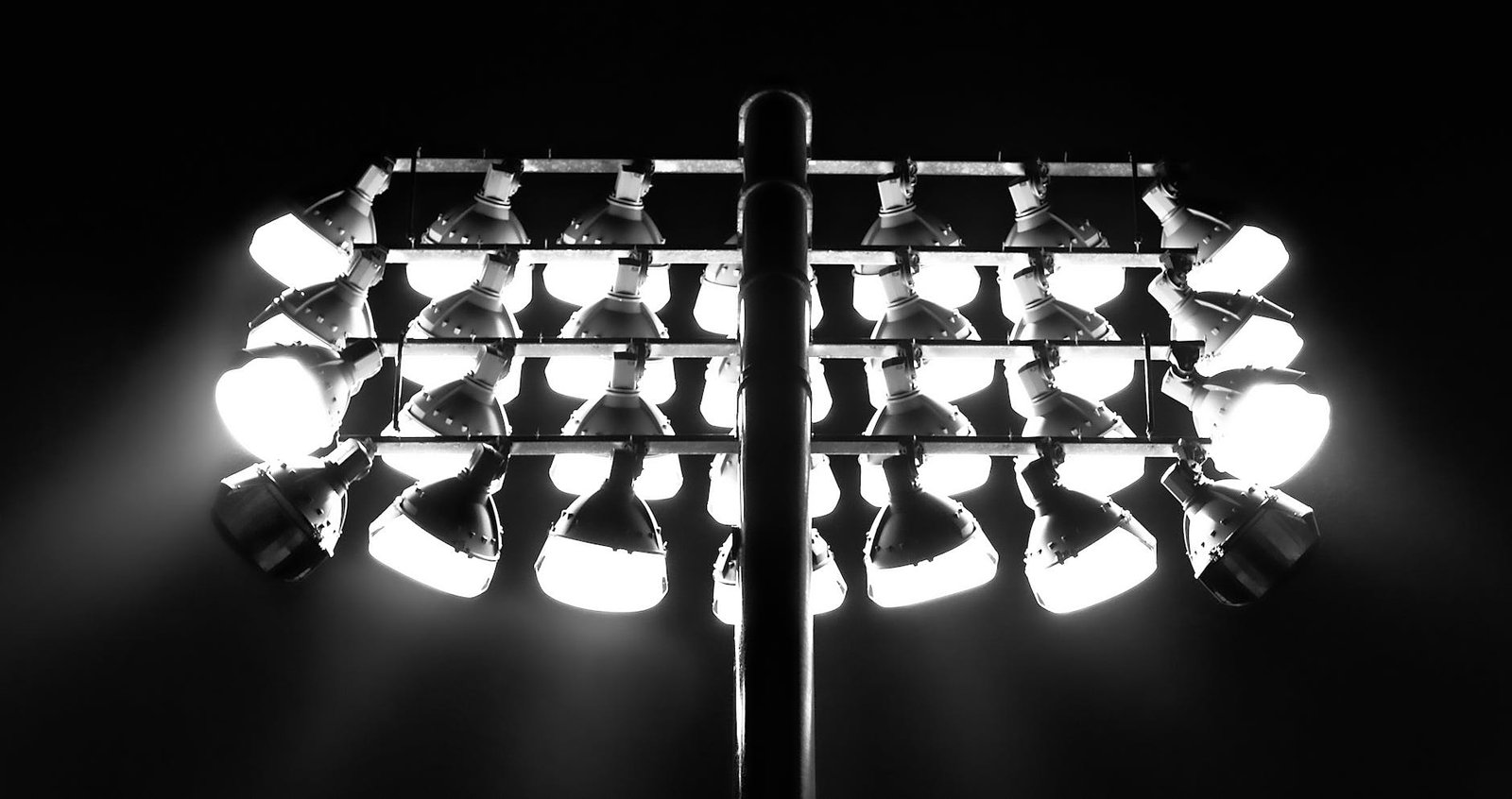 grayscale photo of floodlights