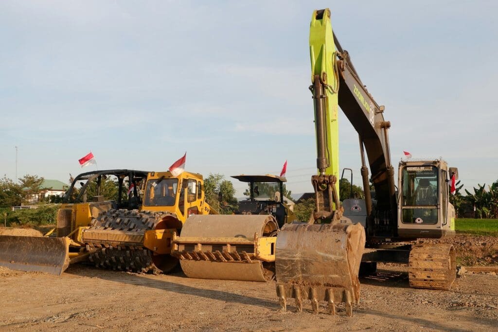 a bulldozer and a bulldozer on a dirt road